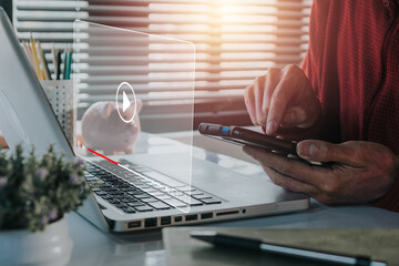 Video streaming on internet, Person using smart phone and watching online movie or TV series on office desk workplace, Concept about subscription based live digital stream.