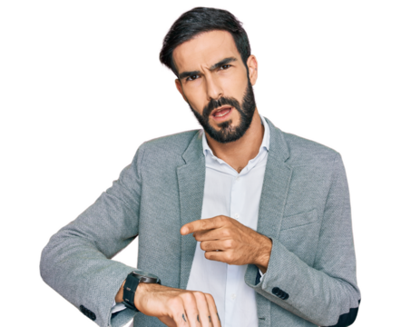 Young hispanic man wearing business clothes in hurry pointing to watch time, impatience, upset and angry for deadline delay