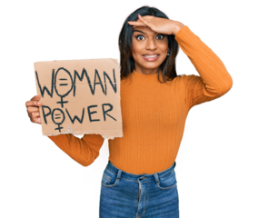 Young latin transsexual transgender woman holding woman power banner stressed and frustrated with hand on head, surprised and angry face