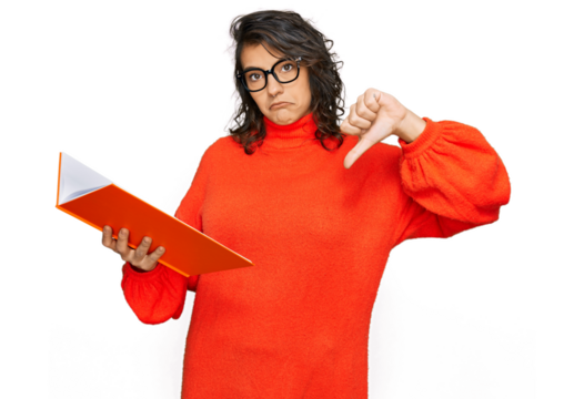 Young hispanic woman reading a book wearing glasses with angry face, negative sign showing dislike with thumbs down, rejection concept