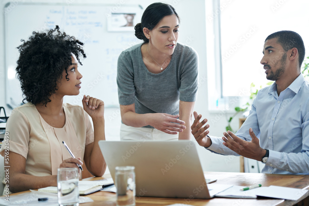 Aufkleber Talking their way to innovative concepts. Shot of a group of professionals using wireless technology during a meeting.