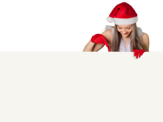 Beautiful blonde woman in Santa hat pointing at banner