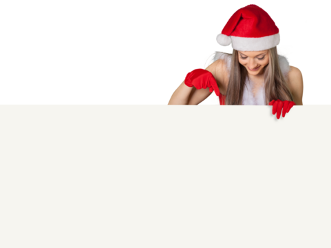 Beautiful blonde woman in Santa hat pointing at banner