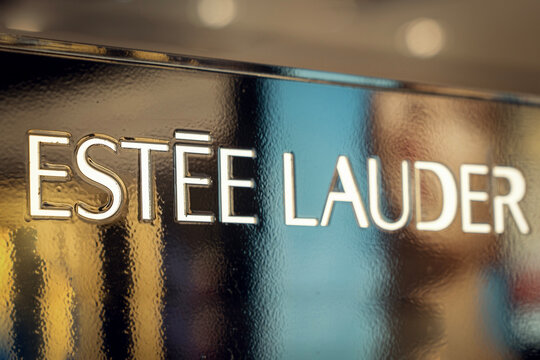 The logo of the world cosmetics manufacturer Estee Lauder on a golden surface. Phuket, Thailand November 17, 2022
