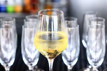 white wine tasting, chilled ice wine in a cold glass in summer
