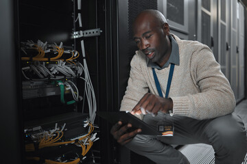 Data center or black man on tablet in server room on database maintenance or software update....