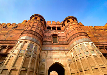 The famous red fort in the city of Agra, India. Tourists visit a popular tourist attraction.