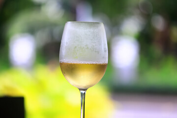 a glass of white wine in a restaurant, alcohol luxury background
