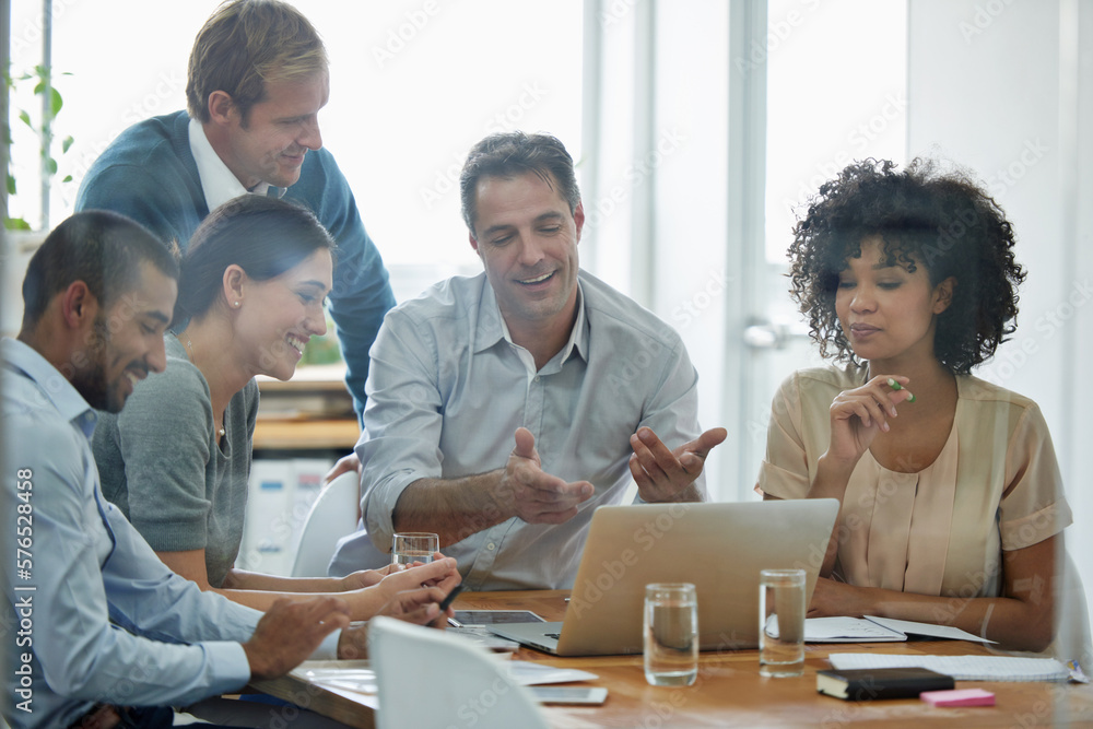 Aufkleber Brainstorming doesnt have to be boring. Shot of a group of professionals using wireless technology during a meeting.