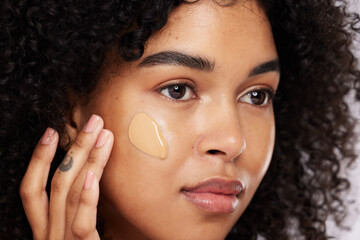 Black woman, beauty and face, foundation and makeup, cosmetics product zoom and cream on studio...