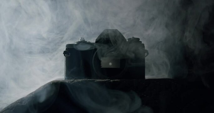 White smoke on a vintage reflex camera with no lens - 01