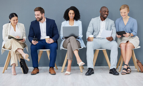 Business People, Diversity And Networking In Row For Collaboration, Teamwork Or Preparing Corporate Meeting. Group Of Diverse Designers Sitting In Waiting Room Working With Technology In Team Startup