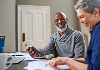 Financial planning has done them the world of good. Cropped shot of a senior couple working on...