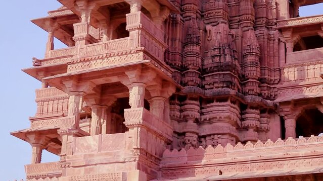 red stone ancient hindu temple architecture from unique angle at day
