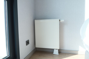 heating radiator under window in the room