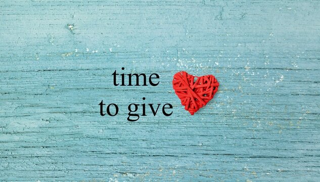 Time to Give words and heart on color background