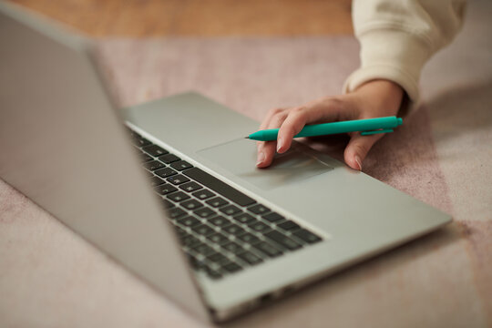 Closeup image of girl working on laptop or studying