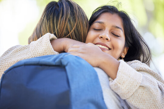 Happy Students, Backpack And Hug In Park, Garden Or School Campus Bonding, Friends Acceptance Or Community Support. Smile, Indian And Women In Embrace On University College For Good Luck Or Thank You