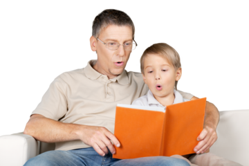 Father and Son Reading a Book on the Couch