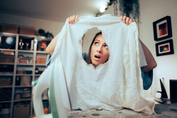 Funny Woman Failing in Ironing a White Shit Making Mistakes. Silly inexperienced domestic worker burning clothes by accident
 - obrazy, fototapety, plakaty