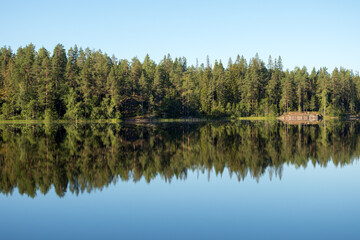 Fototapeta na wymiar symmetrical landscape on the lake