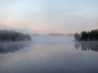 Fototapeta na wymiar landscape with morning mist over lake