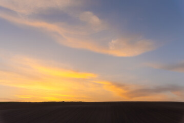 Fototapeta na wymiar Farmland, a hill with blue sky background in dusk. Silhouette view nature landscape.