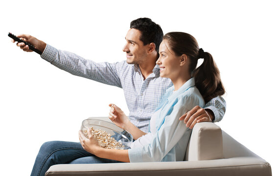 Young happy couple watching tv on a sofa