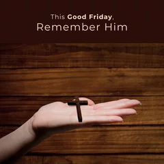 Fototapeten Image of good friday text over hand holding cross © vectorfusionart
