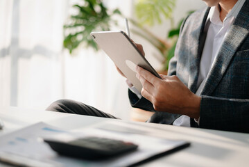 Man using on smartphone and tablet at home as concept.