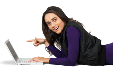 Young woman lying down in front of a laptop