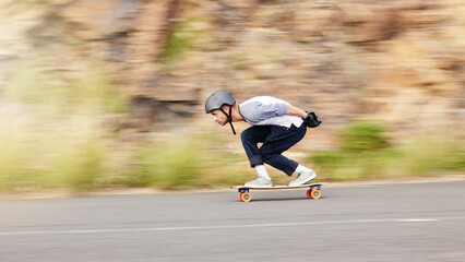 Skateboard, motion and mountain with man in road for speed, freedom and summer break. Sports,...