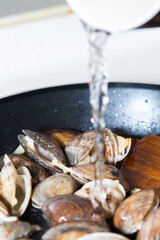 Today's menu is steamed clams with butter