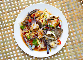 spicy green mango salad with blue crab
