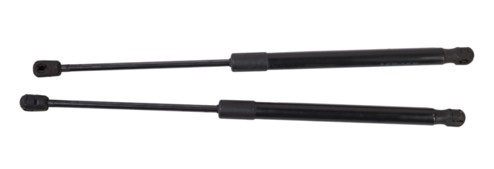 A pair of black metal hood shock absorbers with chrome elements - detail of a car mechanism on a white isolated background. Spare parts for body repair.