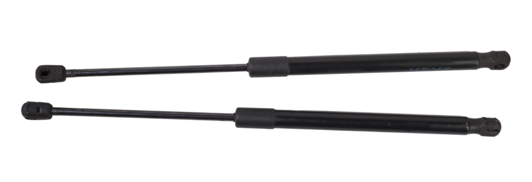 A pair of black metal hood shock absorbers with chrome elements - detail of a car mechanism on a white isolated background. Spare parts for body repair.