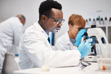 Science, vial and black man with focus, laboratory and innovation for healthcare, wellness and...