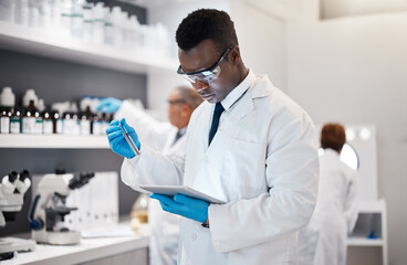 Science, research and black man in laboratory with tablet for medical analysis and digital innovation in medicine. Pharmaceutical analytics, web and scientist in South Africa checking results online.