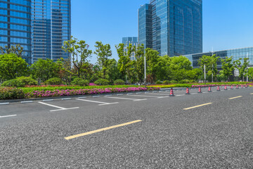 empty asphalt road front of modern buildings