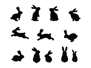 Set of silhouettes of rabbits in various poses.