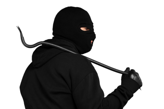 Thief in black balaclava and clothes with handcuffs isolated on white