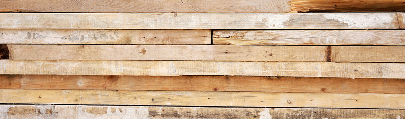 wooden background with pile of planks
