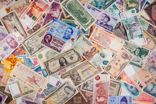 World banknotes collection mixed on table, top view