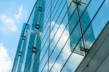 Clouds Reflected in Windows of Modern Office Building.