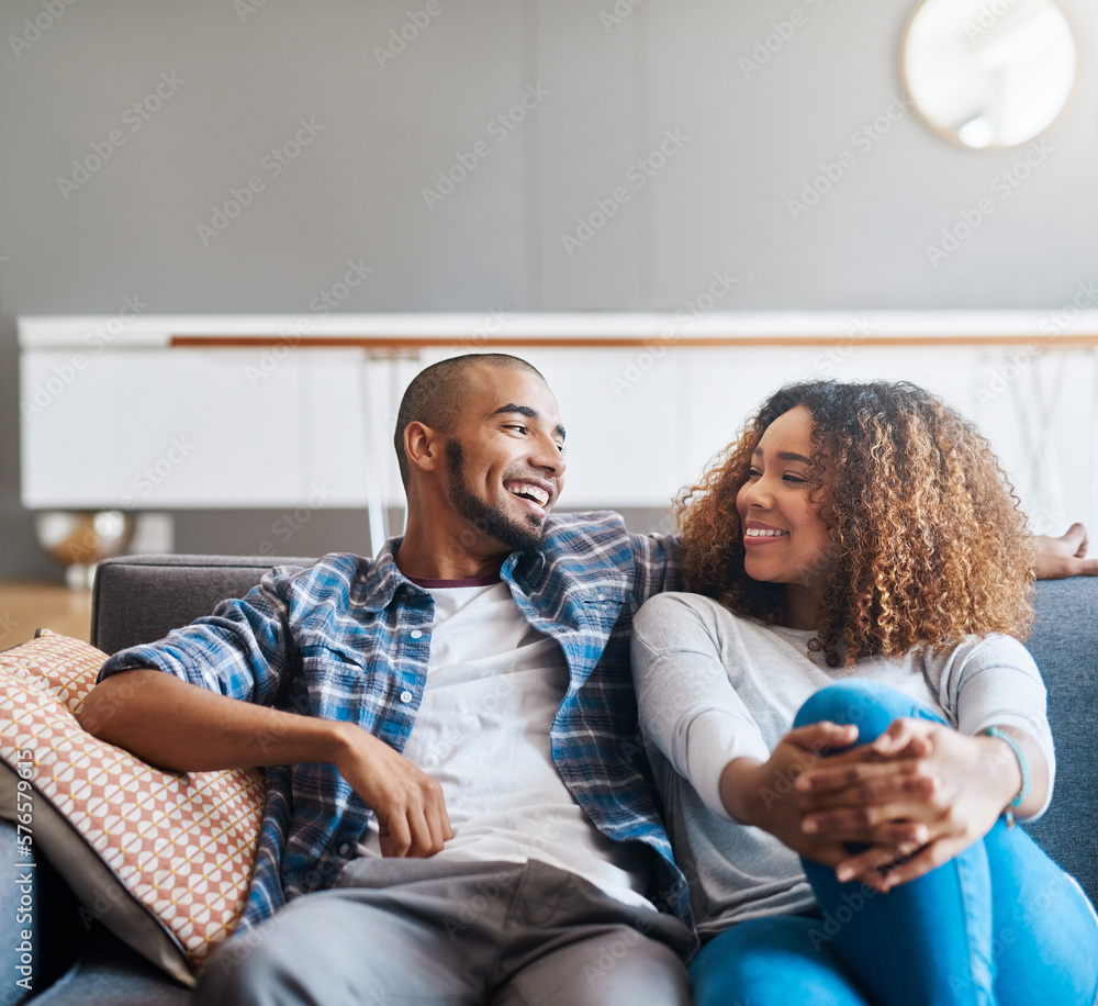 Canvas Prints Im never too busy for my bae. Shot of a happy young couple relaxing together on the sofa at home.