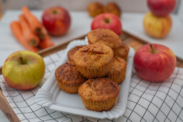 home made apple carrot muffins on a table
