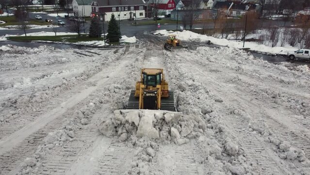Snow plow, plowing in north america after a big winter storm