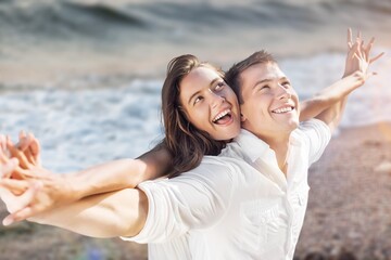 Obraz premium Fun cute young couple on vacation having fun.