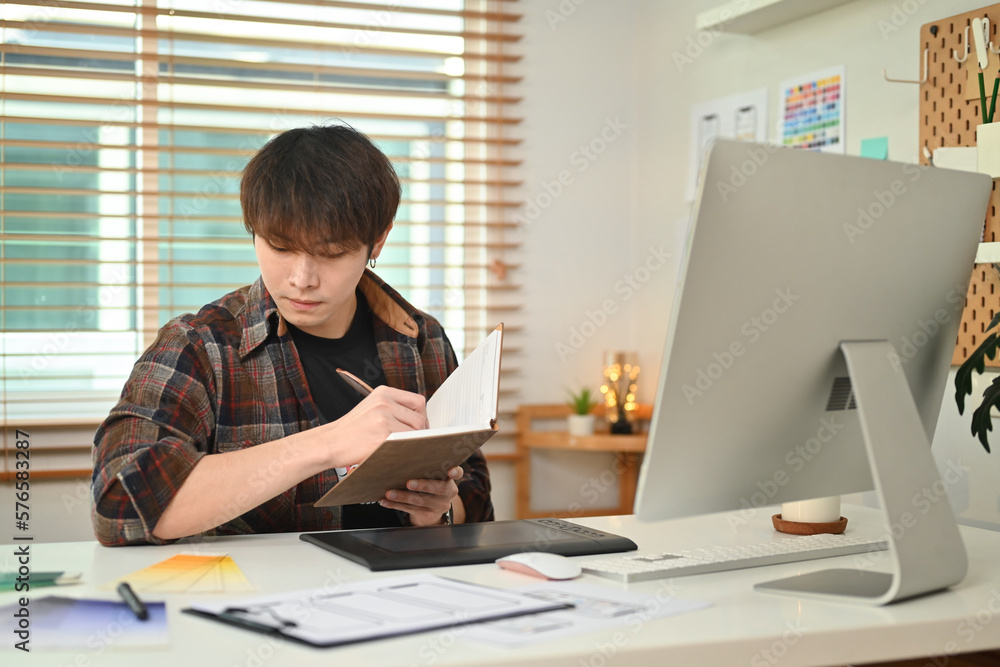 Aufkleber young creative man using digital tablet, working on application template layout framework for mobile