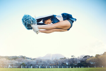 Cheerleader woman, jump and sports outdoor on blue sky for performance, energy and celebration....